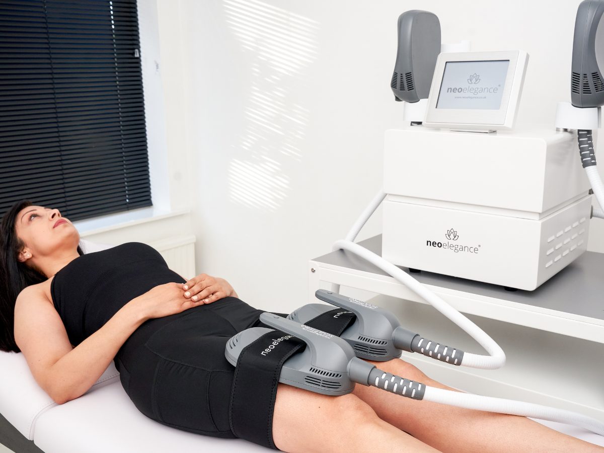 Client relaxing during a Body Sculpt Pro muscle toning treatment on the thighs at Neo Elegance Skin Clinic, Derby