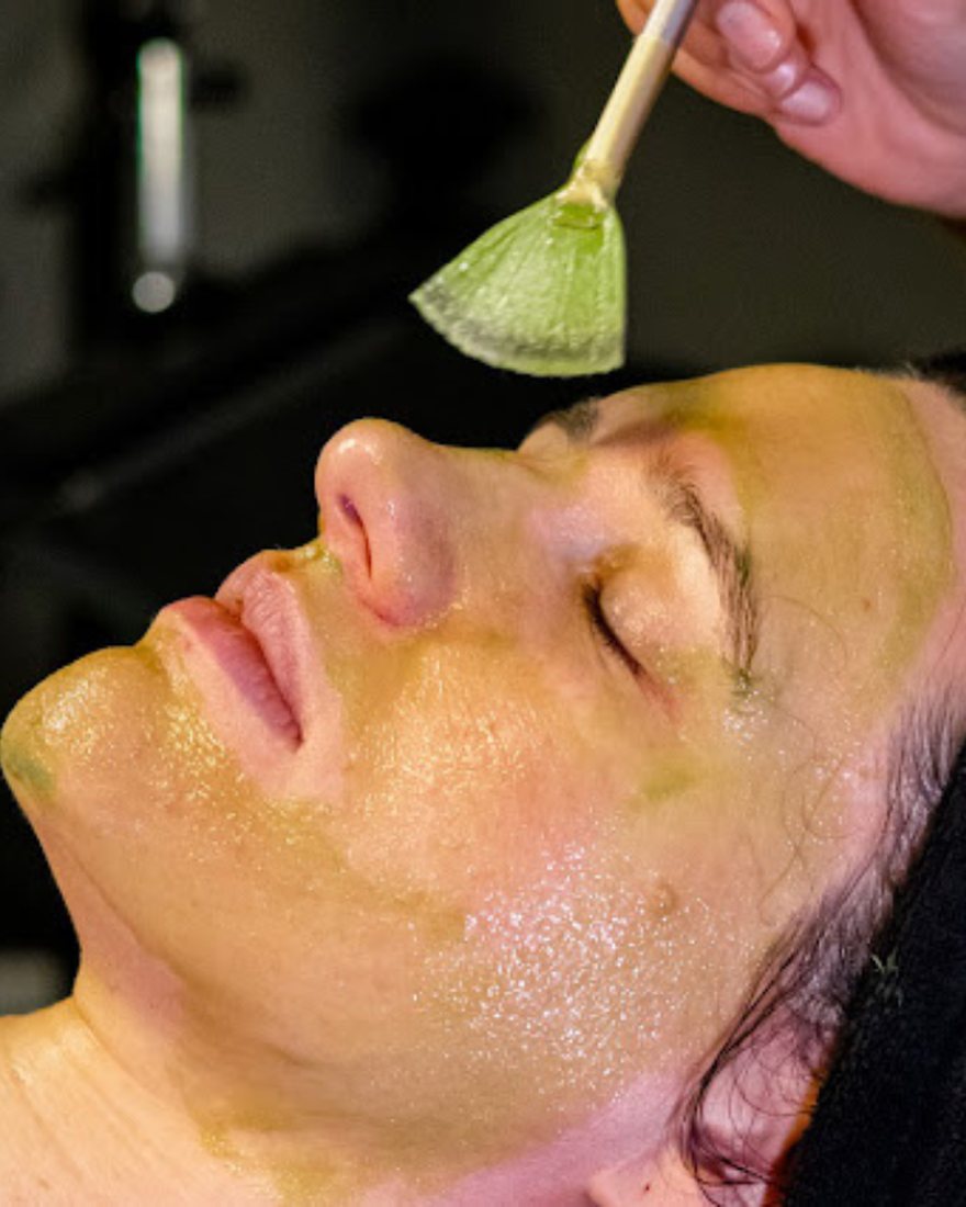 Calming mask being applied with a fan brush during a sensitive skin facial at Neo Elegance Skin Clinic, Derby